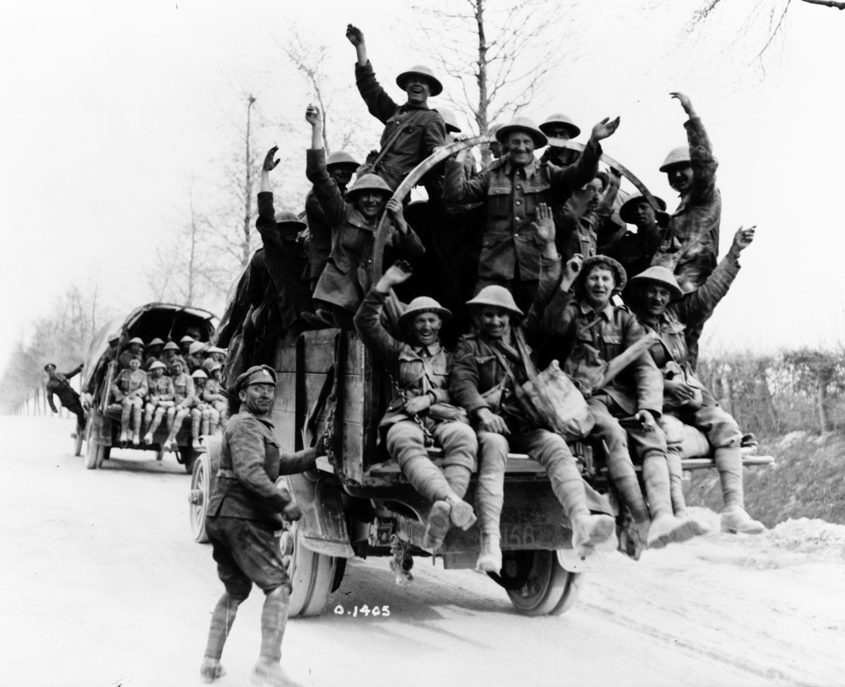 A historical black and white photo of jubilant Canadian soldiers in WWI, representing expertise in Canadian history websites.